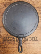 Classic 1910’s Lodge #7 Cast Iron Skillet Three Notch with raised T. Light sleek and ready to cook with! Skillet