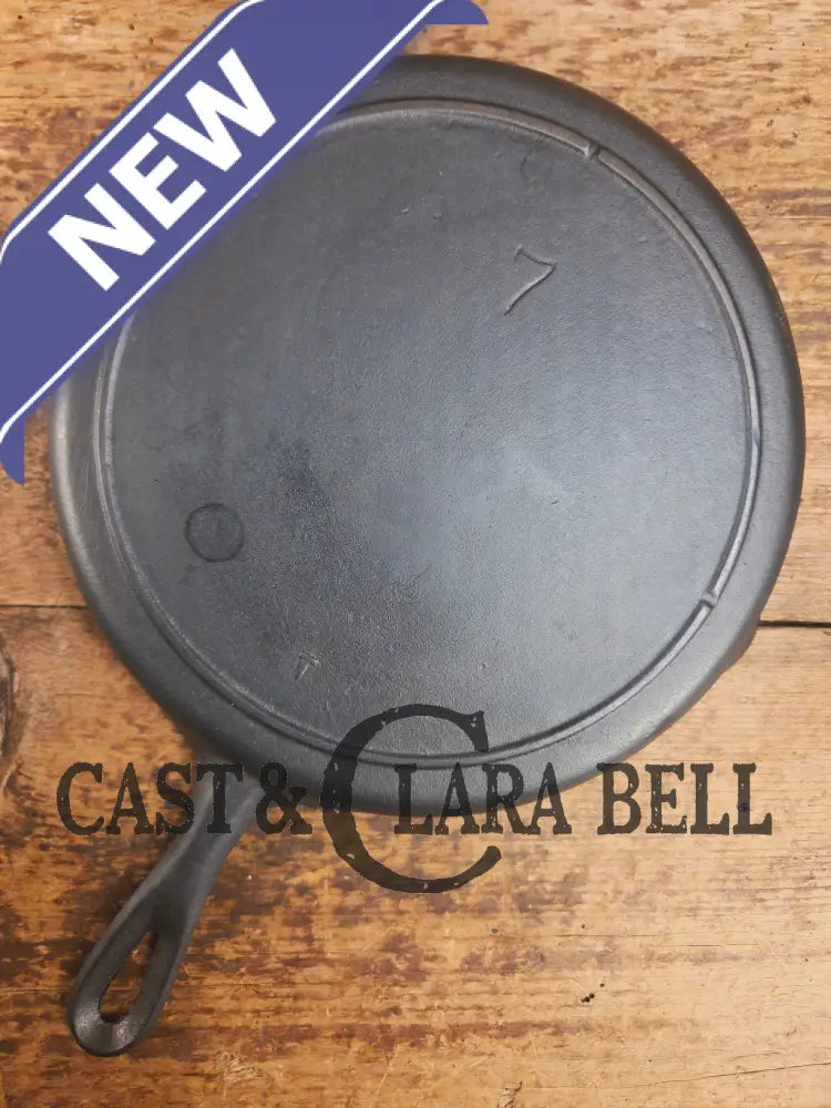 Classic 1910’s Lodge #7 Cast Iron Skillet Three Notch with raised T. Light sleek and ready to cook with! Skillet