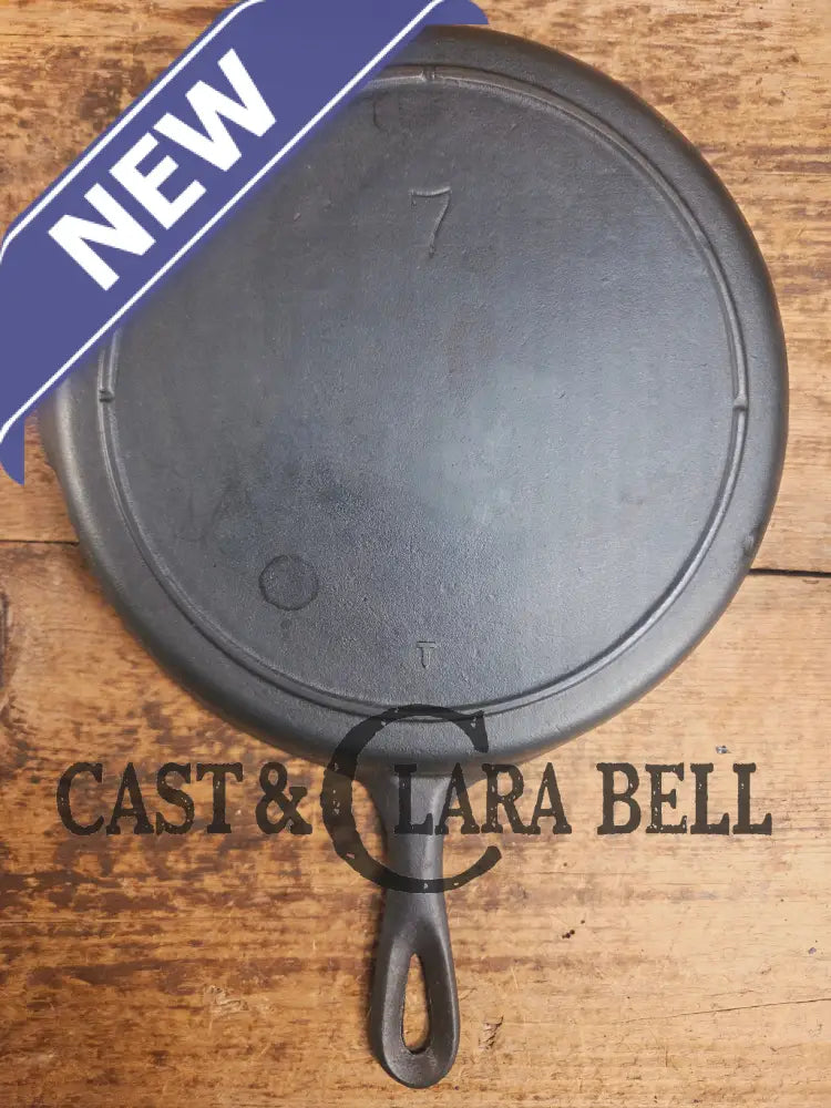 Classic 1910’s Lodge #7 Cast Iron Skillet Three Notch with raised T. Light sleek and ready to cook with! Skillet