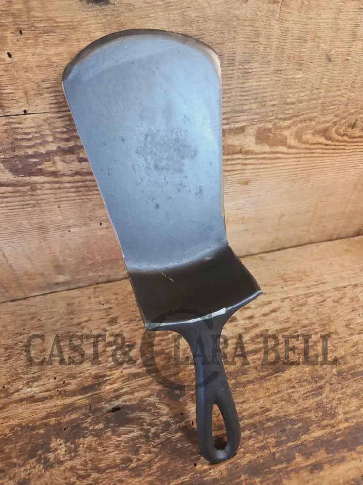 Custom made #5 Lodge Cast Iron Skillet Spatula w RAISED B. Reclaimed from a early to mid 1900’s single notch Lodge