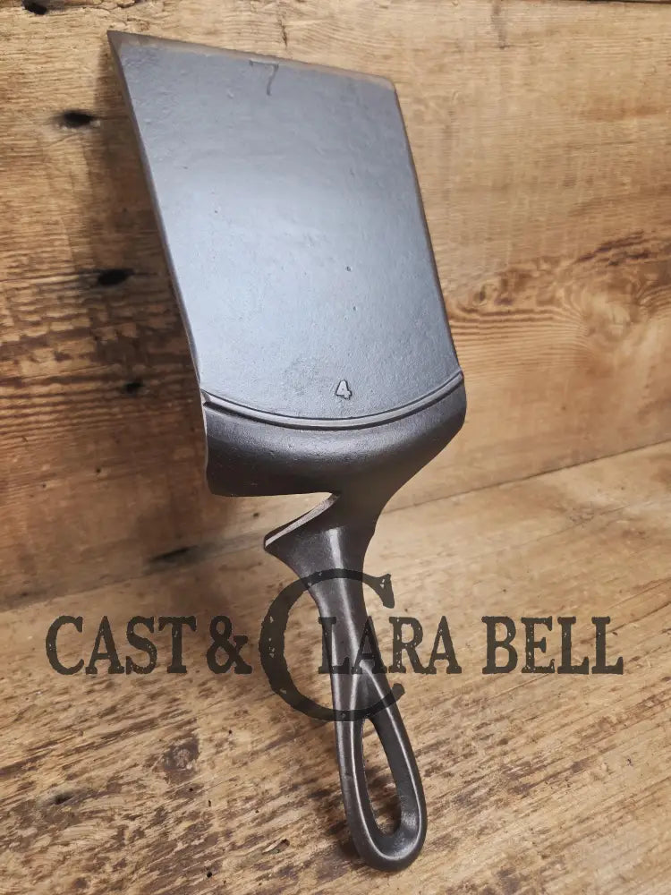 Custom made one of a kind early #7 1900’s Lodge no notch repurposed spatula. Turned an ordinary cracked skillet into a