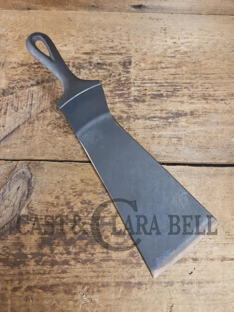 Custom made one of a kind early #9 1900’s Lodge repurposed spatula. Turned an ordinary cracked skillet into a grill