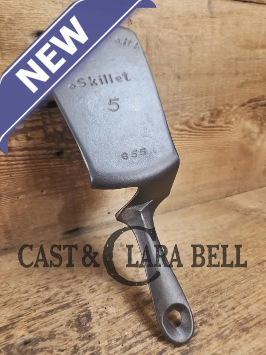 Custom made one of a kind Griswold Good Health #5 repurposed spatula. Turned an ordinary cracked skillet into an