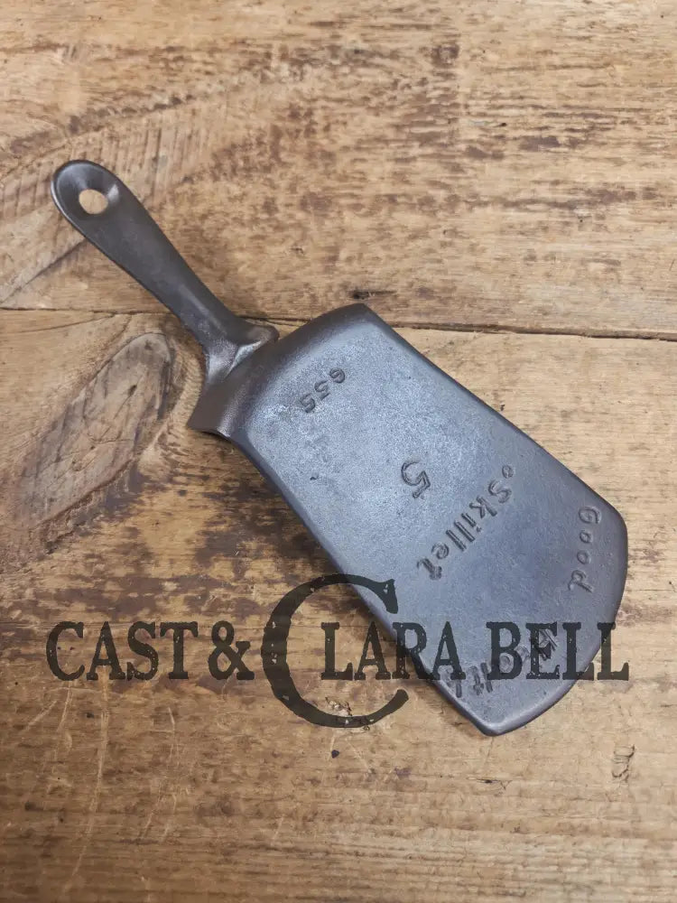 Custom made one of a kind Griswold Good Health #5 repurposed spatula. Turned an ordinary cracked skillet into an