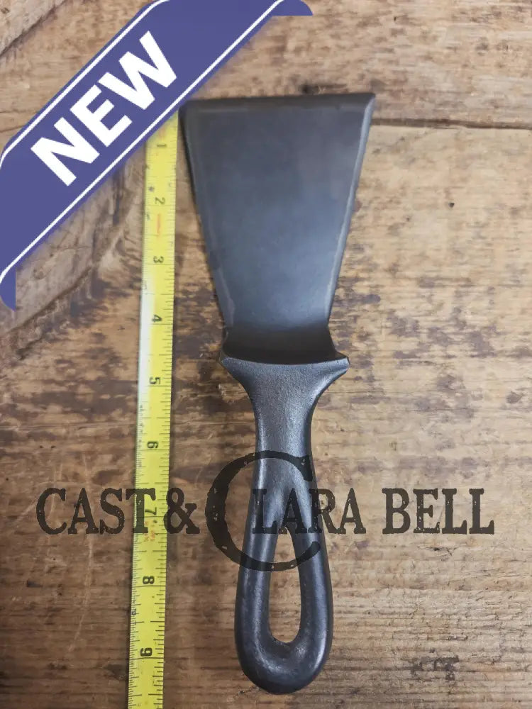 Custom made small Wagner HAMMERED Cast Iron Skillet Spatula. Reclaimed from a #3 Wagner hammered cast iron skillet.