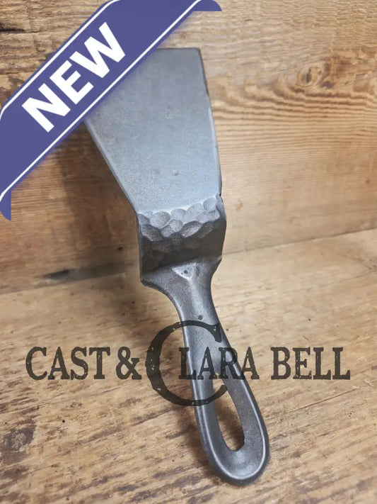 Custom made small Wagner HAMMERED Cast Iron Skillet Spatula. Reclaimed from a #3 Wagner hammered cast iron skillet.