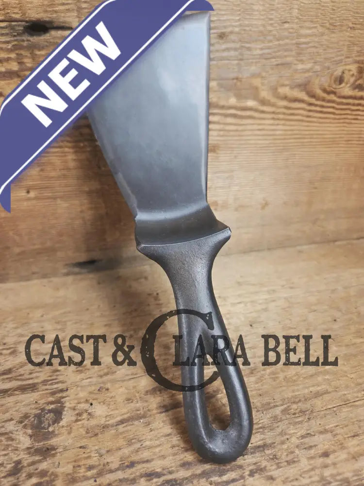 Custom made small Wagner HAMMERED Cast Iron Skillet Spatula. Reclaimed from a #3 Wagner hammered cast iron skillet.