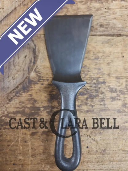 Custom made small Wagner HAMMERED Cast Iron Skillet Spatula. Reclaimed from a #3 Wagner hammered cast iron skillet.