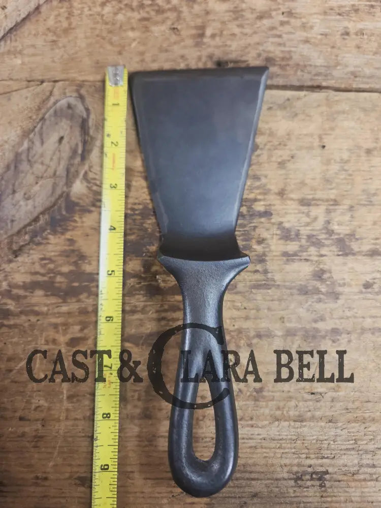 Custom made small Wagner HAMMERED Cast Iron Skillet Spatula. Reclaimed from a #3 Wagner hammered cast iron skillet.