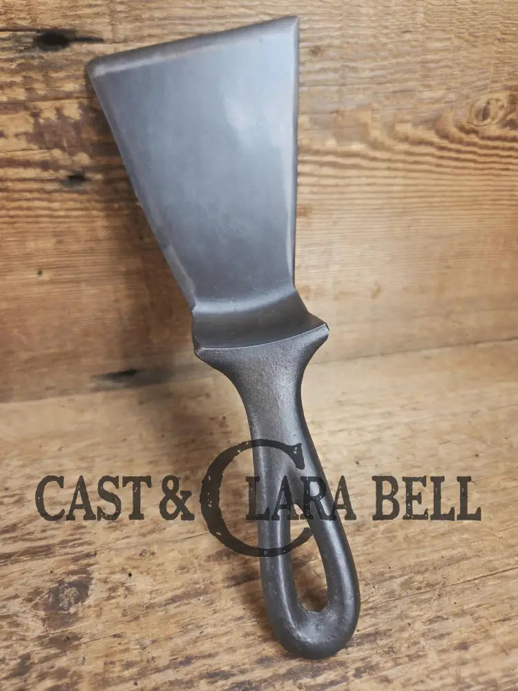 Custom made small Wagner HAMMERED Cast Iron Skillet Spatula. Reclaimed from a #3 Wagner hammered cast iron skillet.