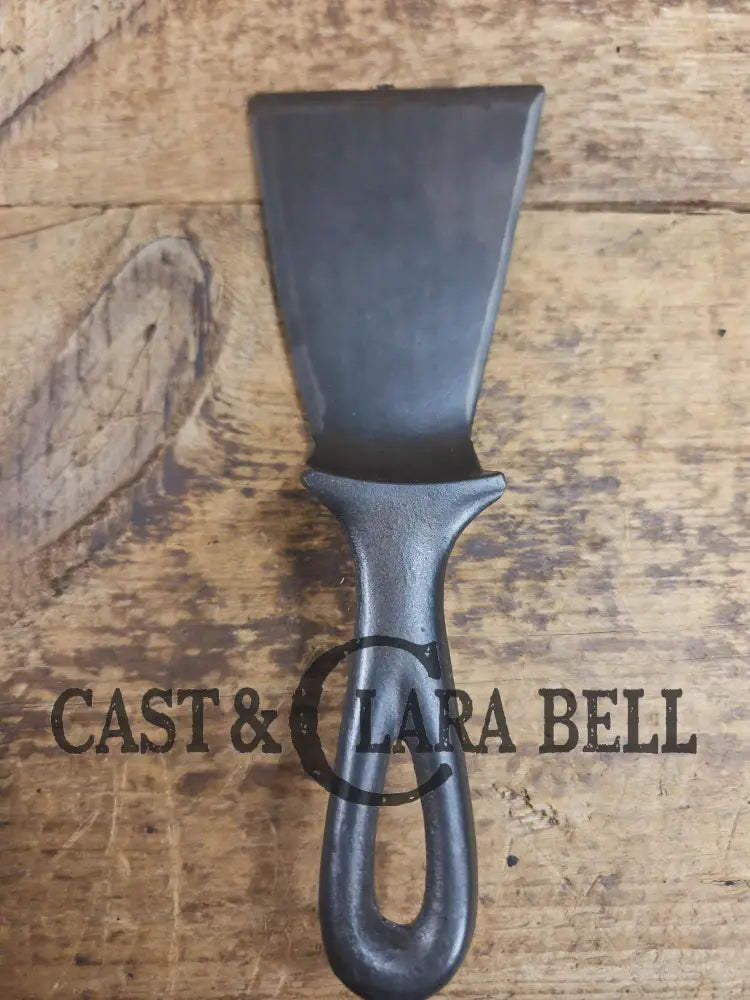 Custom made small Wagner HAMMERED Cast Iron Skillet Spatula. Reclaimed from a #3 Wagner hammered cast iron skillet.