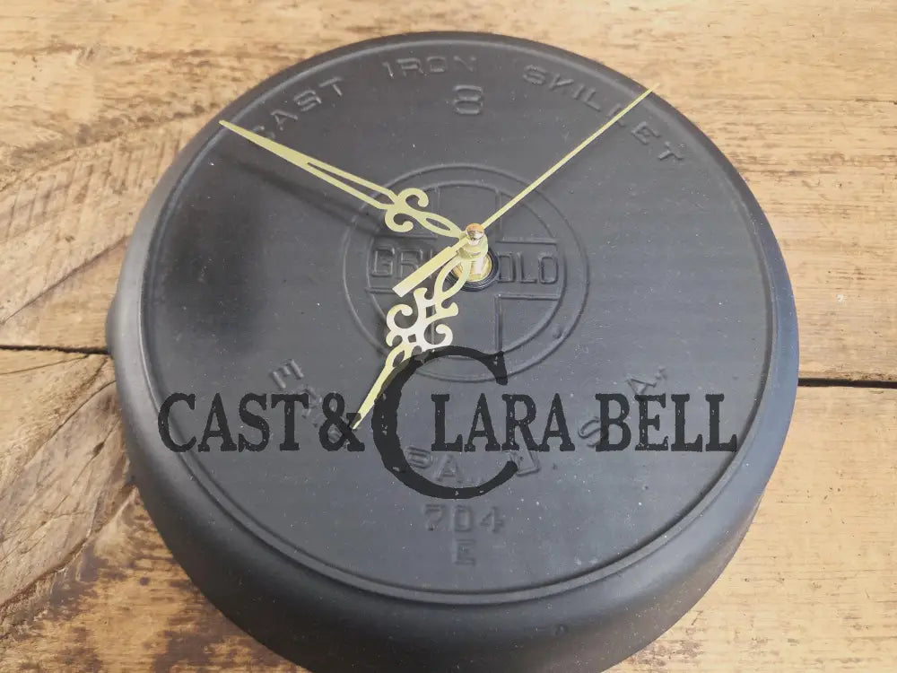 Custom made wall hanging Griswold Clock. Repurposed from cracked skillet. Comes with interchangeable clock mechanics.