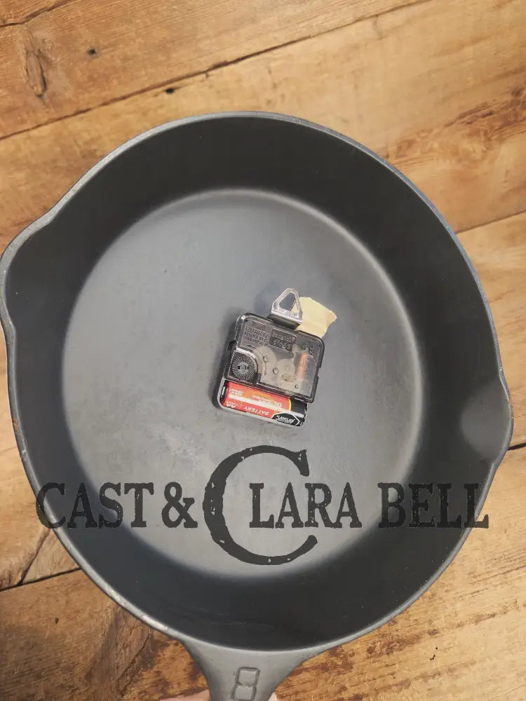 Custom made wall hanging Griswold Clock. Repurposed from cracked skillet. Comes with interchangeable clock mechanics.