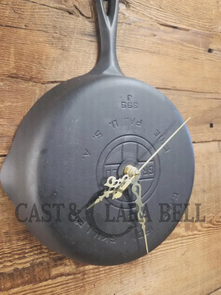 Custom made wall hanging Griswold Clock. Repurposed from cracked skillet. Comes with interchangeable clock mechanics.