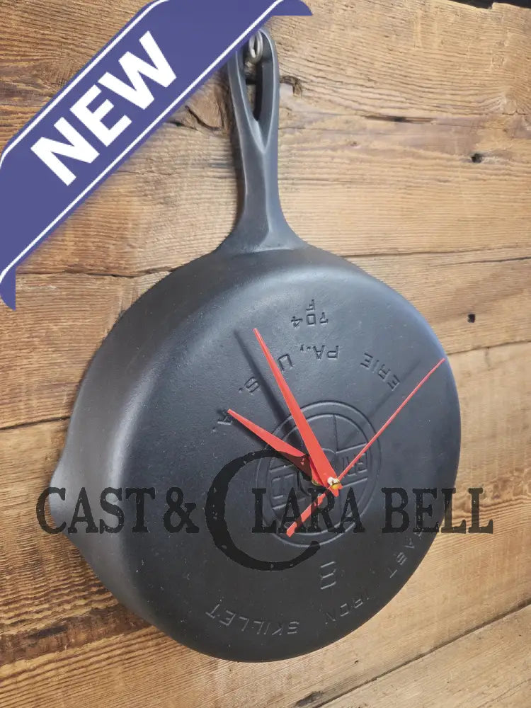 Custom made wall hanging Griswold Clock. Repurposed from cracked skillet. Comes with interchangeable clock mechanics.