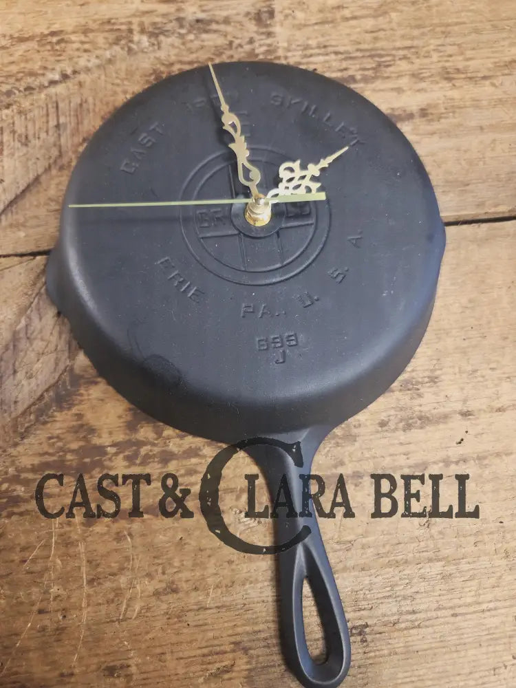 Custom made wall hanging Griswold Clock. Repurposed from cracked skillet. Comes with interchangeable clock mechanics.