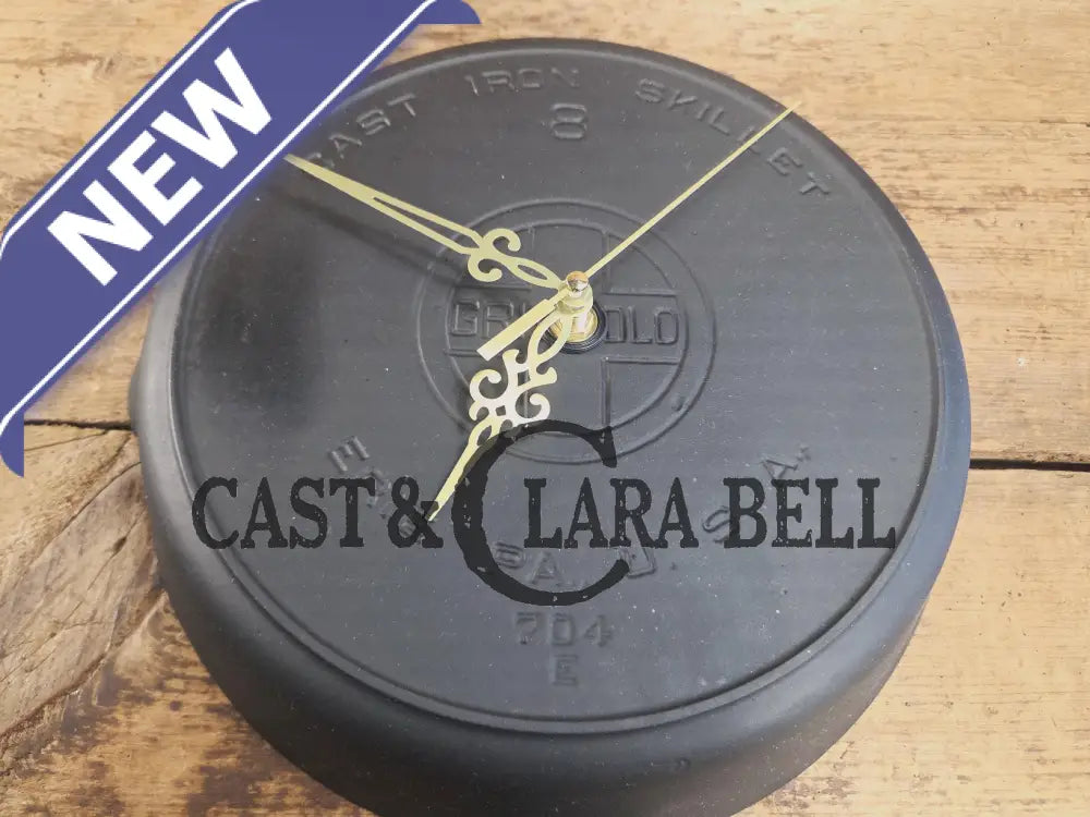 Custom made wall hanging Griswold Clock. Repurposed from cracked skillet. Comes with interchangeable clock mechanics.