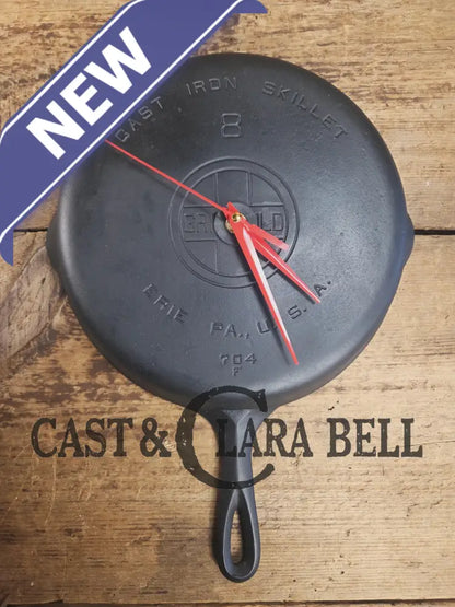 Custom made wall hanging Griswold Clock. Repurposed from cracked skillet. Comes with interchangeable clock mechanics.