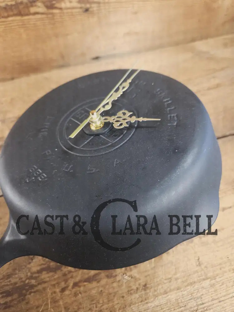 Custom made wall hanging Griswold Clock. Repurposed from cracked skillet. Comes with interchangeable clock mechanics.