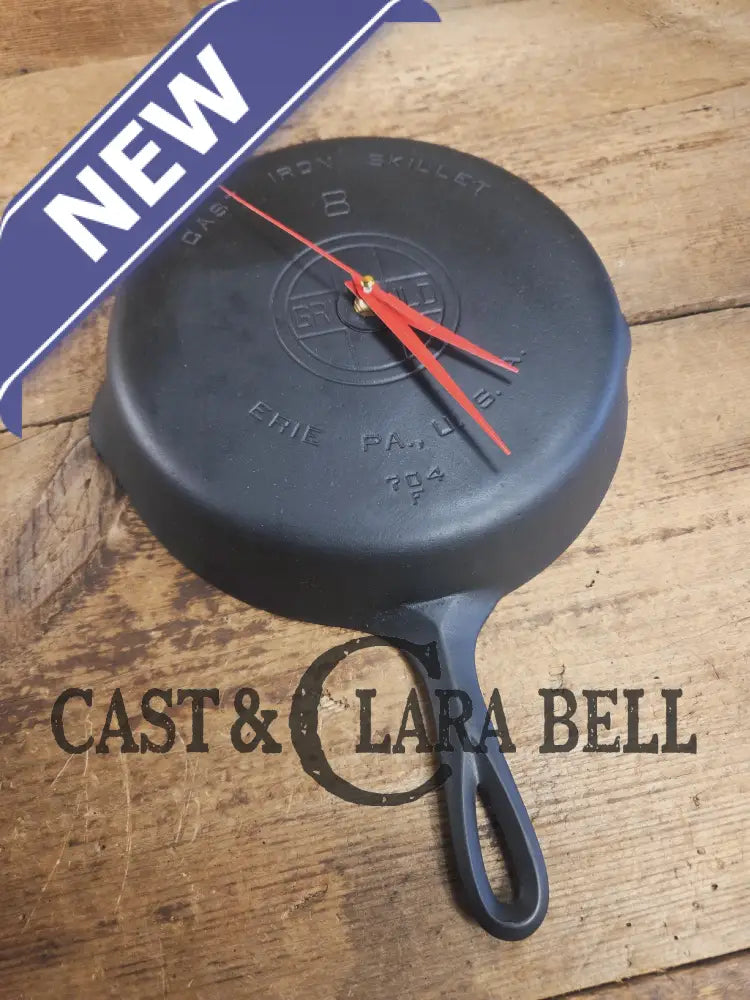 Custom made wall hanging Griswold Clock. Repurposed from cracked skillet. Comes with interchangeable clock mechanics.