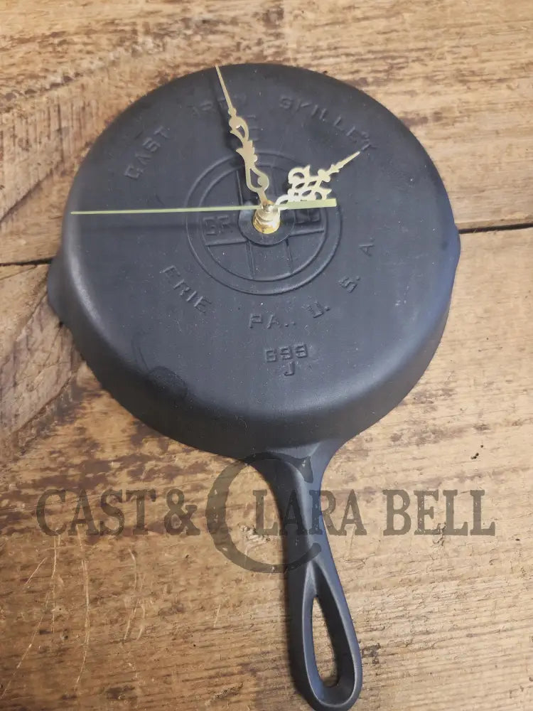 Custom made wall hanging Griswold Clock. Repurposed from cracked skillet. Comes with interchangeable clock mechanics.