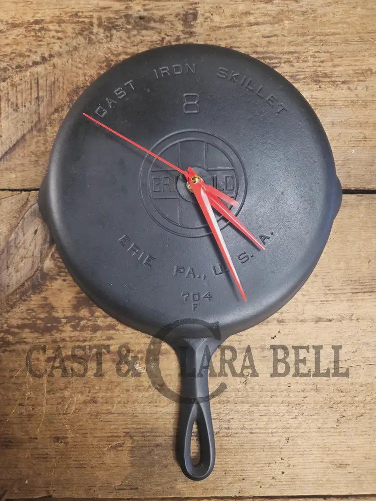 Custom made wall hanging Griswold Clock. Repurposed from cracked skillet. Comes with interchangeable clock mechanics.
