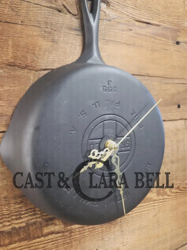 Custom made wall hanging Griswold Clock. Repurposed from cracked skillet. Comes with interchangeable clock mechanics.