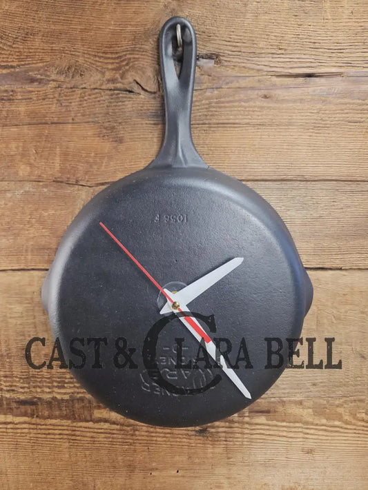 Custom made wall hanging Wagner Clock. Repurposed from cracked skillet. Comes with interchangeable clock mechanics.