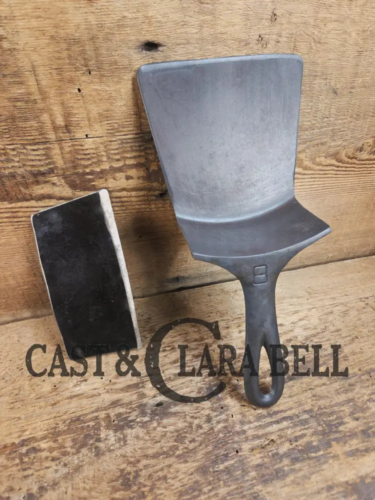 Custom Repurposed Burger Spatula AND grill scraper. Made from a center cracked Griswold 704 skillet. Awesome for the