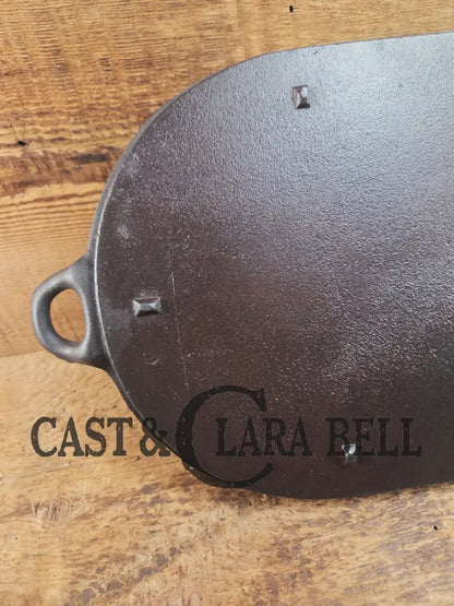 Early 1900’s (Lodge?) #7 cast iron long pan with foot nubs. Perfect for two people or quick meals. VERY cool griddle to
