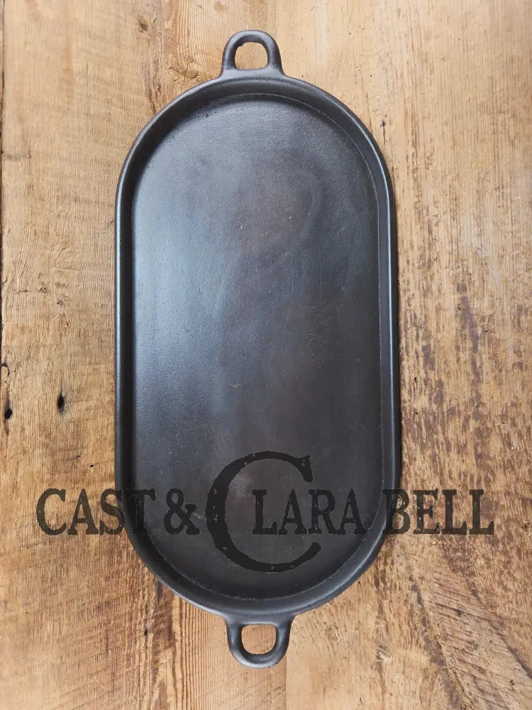 Early 1900’s (Lodge?) #7 cast iron long pan with foot nubs. Perfect for two people or quick meals. VERY cool griddle to