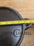 Early 1900’s (Lodge?) #7 cast iron long pan with foot nubs. Perfect for two people or quick meals. VERY cool griddle to