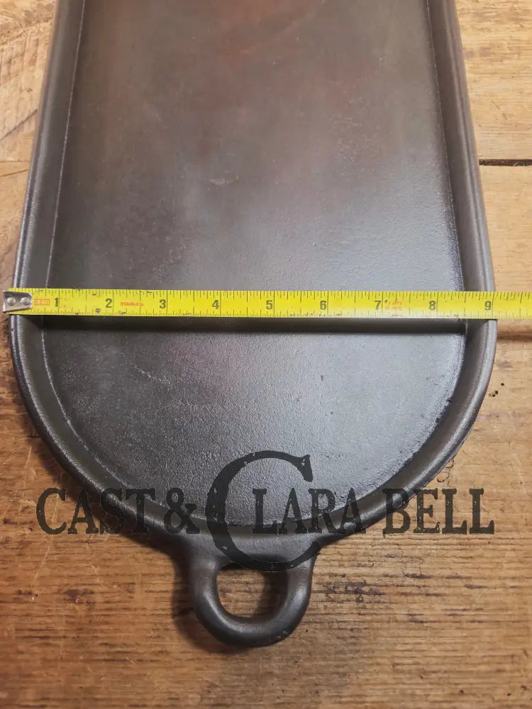 Early 1900’s (Lodge?) #7 cast iron long pan with foot nubs. Perfect for two people or quick meals. VERY cool griddle to