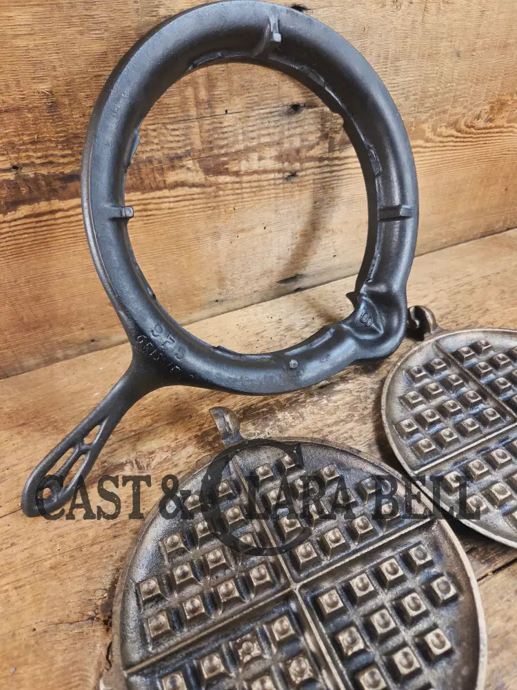 For the eclectic enthusiast!! 1920’s Griswold #8 Waffle Iron 885/886 with Matching Low Base 975. Plated paddles Black