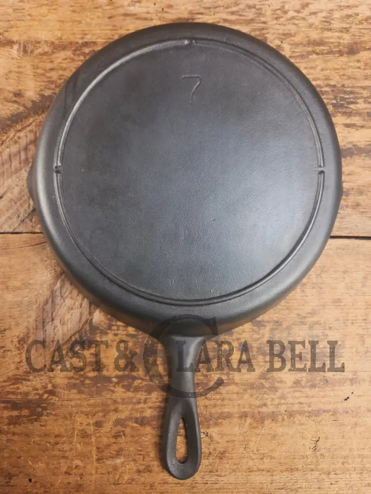 Gorgeous. Classic 1910’s Lodge #7 Cast Iron Skillet Three Notch. Light sleek and ready to cook with! Skillet