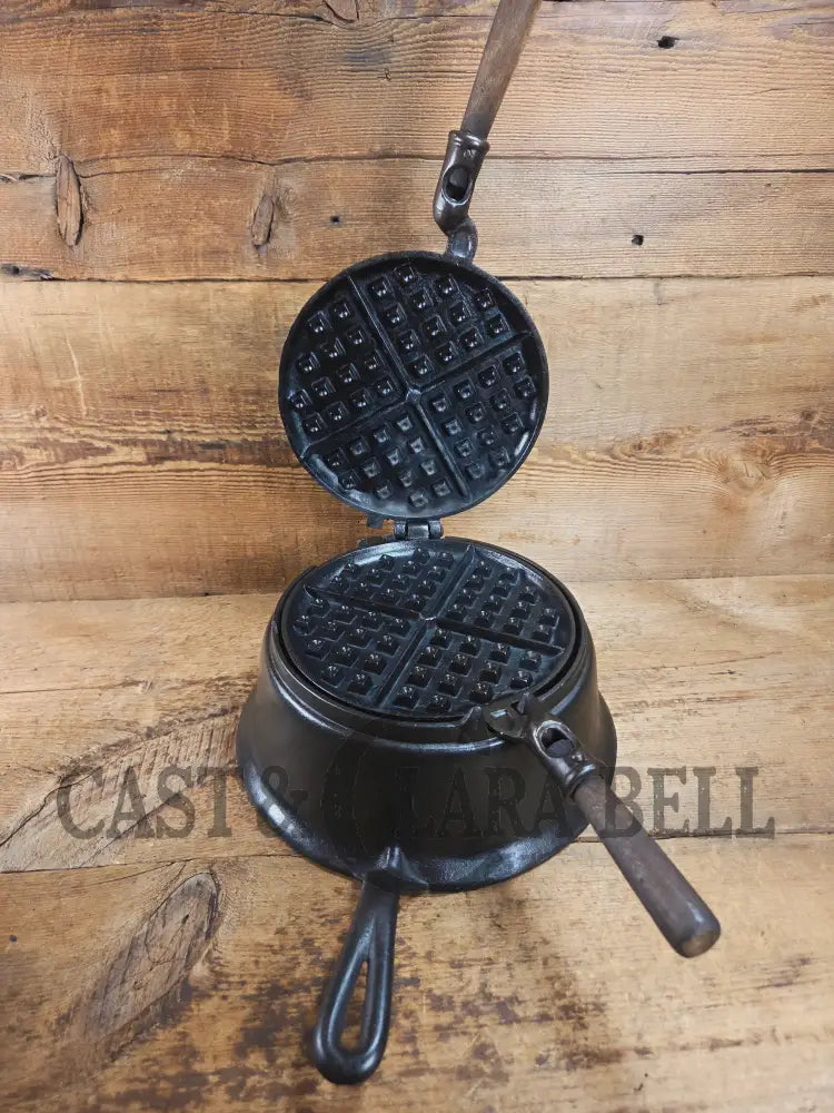 Gorgeous original complete Favorite Piqua tall base waffle iron. Hard to Find Est 1920’s and makes crispy waffles!