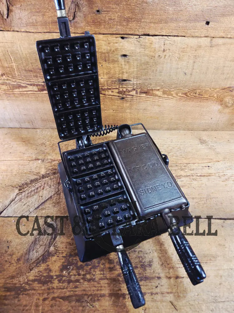 Hard to find and priced to sell! 1910’s Era Wagner Waffle Iron with matching bailed base. Don’t miss this one! Waffle