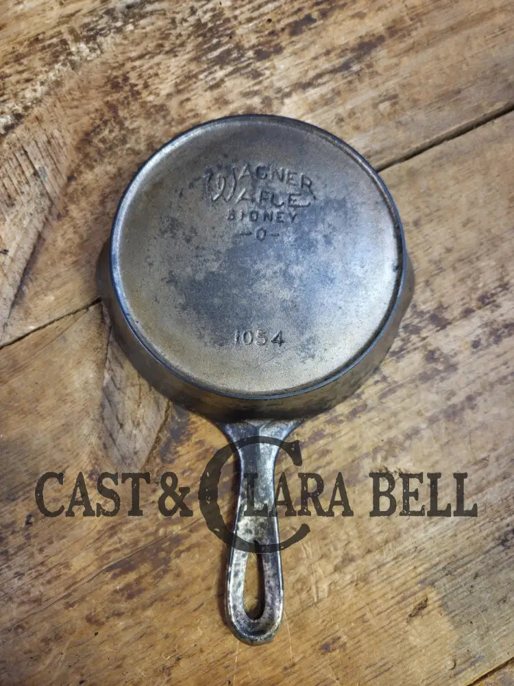 HTF! 1924 Wagner Ware #4 Cast Iron Skillet with Heat Ring 1054. Plating outside black iron inside. Beautiful patina!