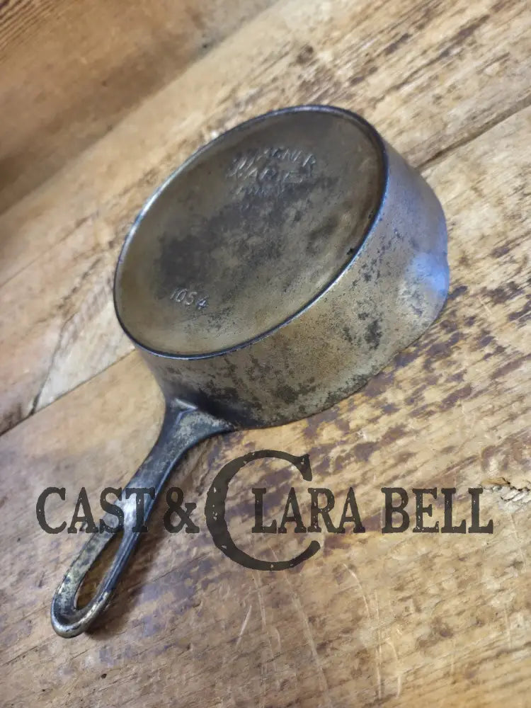 HTF! 1924 Wagner Ware #4 Cast Iron Skillet with Heat Ring 1054. Plating outside black iron inside. Beautiful patina!