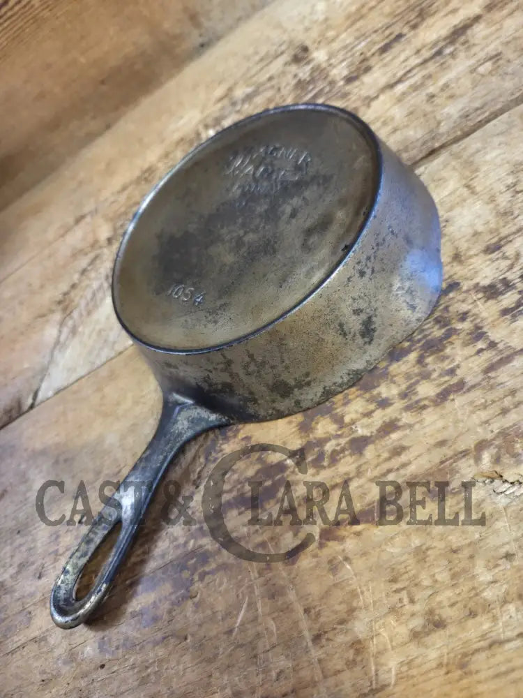 HTF! 1924 Wagner Ware #4 Cast Iron Skillet with Heat Ring 1054. Plating outside black iron inside. Beautiful patina!