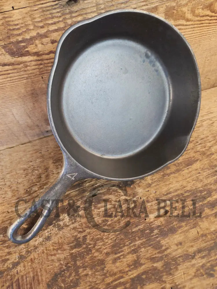 HTF! 1924 Wagner Ware #4 Cast Iron Skillet with Heat Ring 1054. Plating outside black iron inside. Beautiful patina!