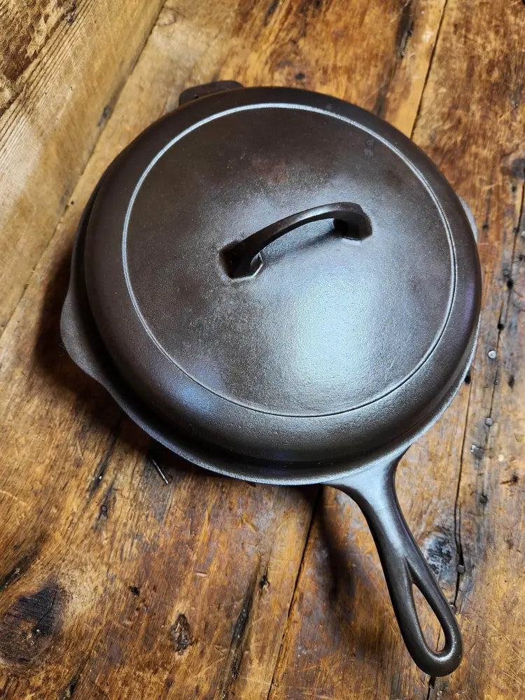 https://castandclarabell.com/cdn/shop/files/htf-griswold-no-8-cast-iron-skillet-with-small-block-logo-2528-and-matching-hinged-lid-2598-awesome-720.webp?v=1699772479&width=1445