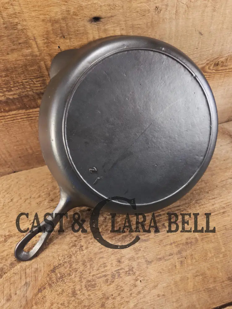 I love this skillet! Classic 1910’s Lodge Raised #7 Heat Ring Single Notch. Light sleek and ready to cook with! Skillet