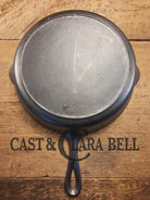 I love this skillet! Classic 1910’s Lodge Raised #7 Heat Ring Single Notch. Light sleek and ready to cook with! Skillet