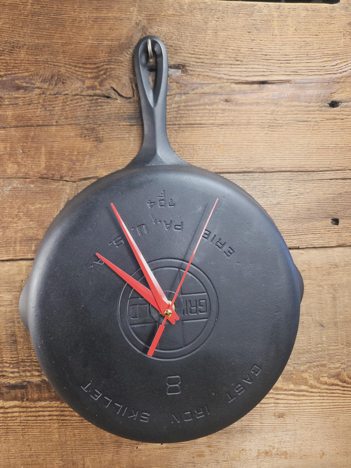 Custom made wall hanging Griswold Clock. Repurposed from cracked skillet. Comes with interchangeable clock mechanics.
