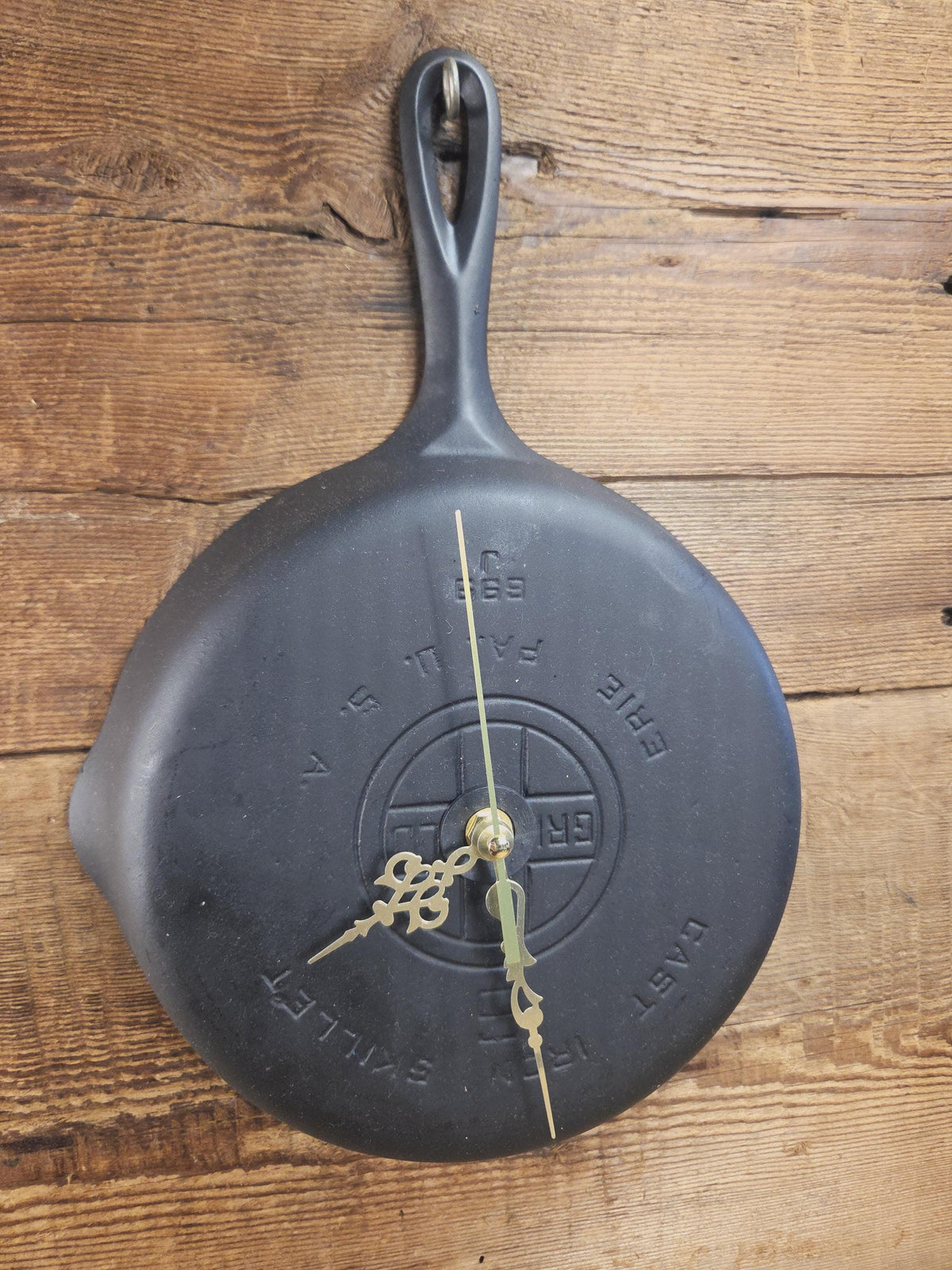 Custom made wall hanging Griswold Clock. Repurposed from cracked skillet. Comes with interchangeable clock mechanics.