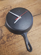 Custom made wall hanging Griswold Clock. Repurposed from cracked skillet. Comes with interchangeable clock mechanics.