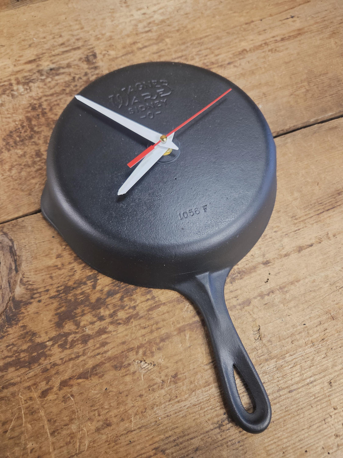 Custom made wall hanging Wagner Clock. Repurposed from cracked skillet. Comes with interchangeable clock mechanics.