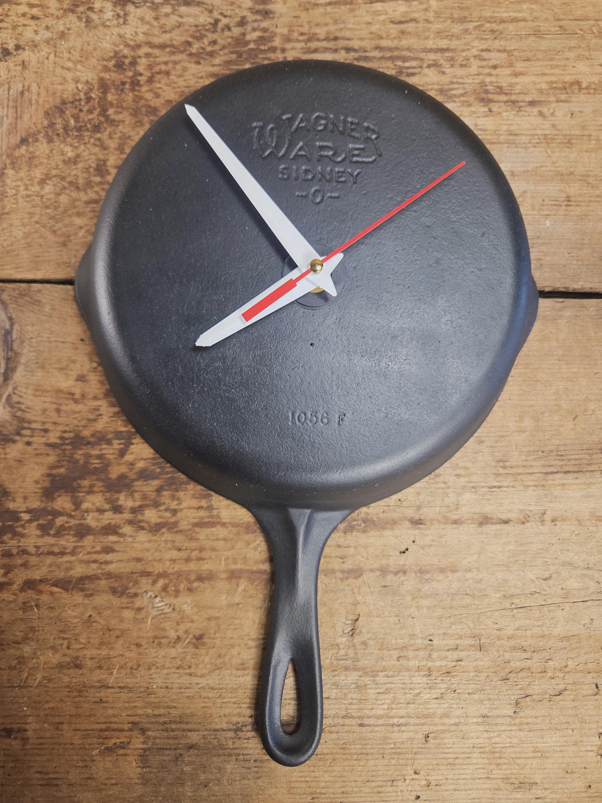 Custom made wall hanging Wagner Clock. Repurposed from cracked skillet. Comes with interchangeable clock mechanics.