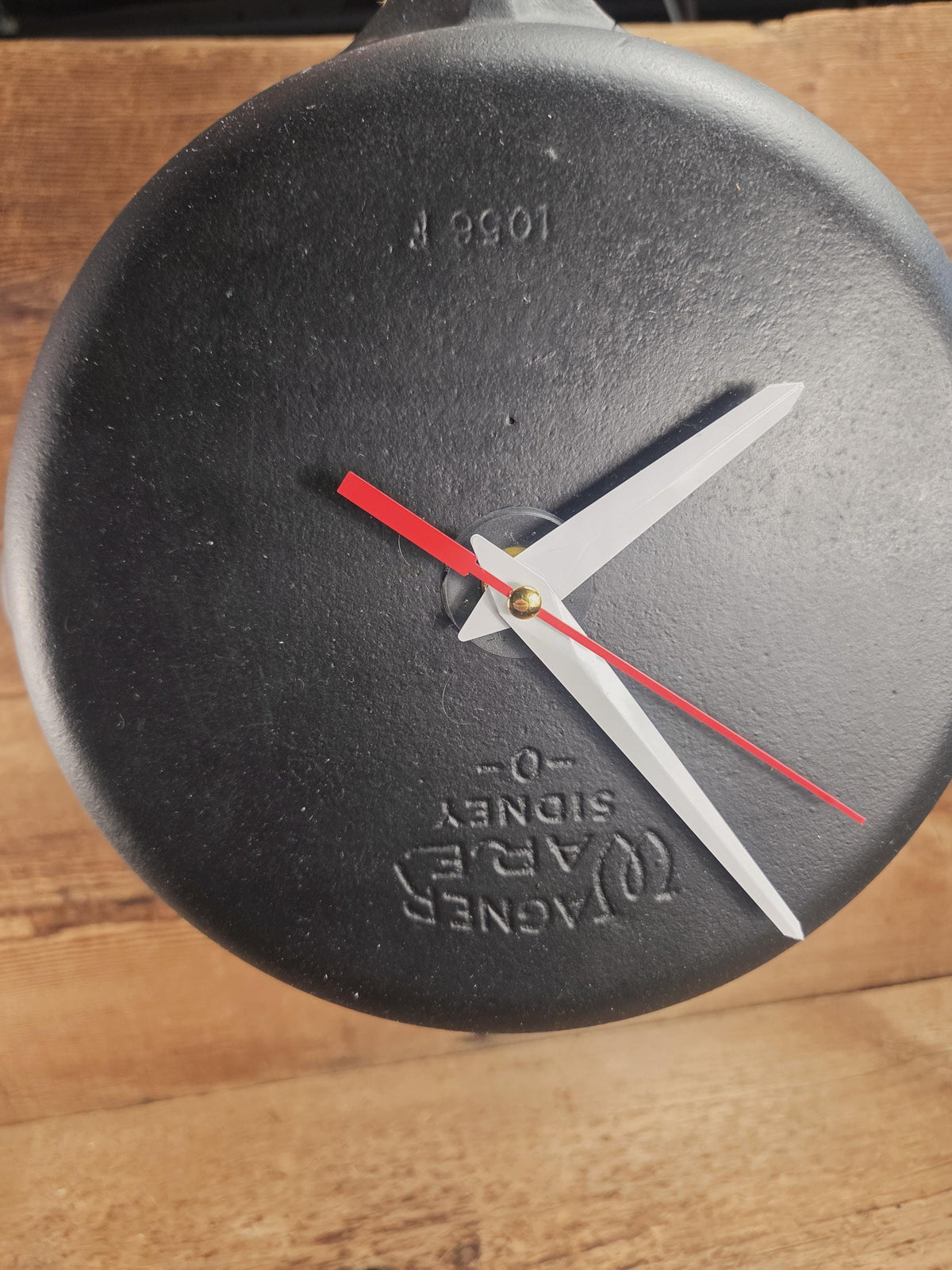 Custom made wall hanging Wagner Clock. Repurposed from cracked skillet. Comes with interchangeable clock mechanics.